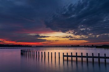 Reflection of poles during sunset