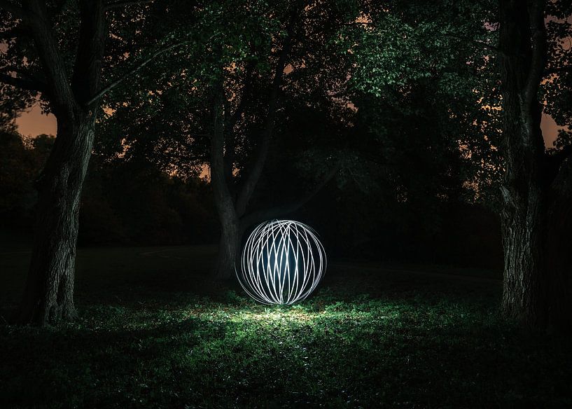 Luminous spherical shape in the forest (lightpainting) by Jolanda Aalbers