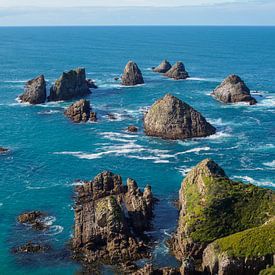 Rocks at the coast of Kaka Point, New Zealand by Lennard Gog