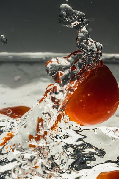 Tomatoes fall into the water by Marc Heiligenstein