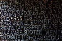 Door from the Sagrada Familia in Barcelona with JESUS in golden letters.