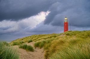 Texel lighthouse in the dunes during a stormy autumn evening