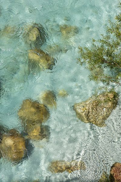 Clear Soca river with rocks by Sander Groenendijk