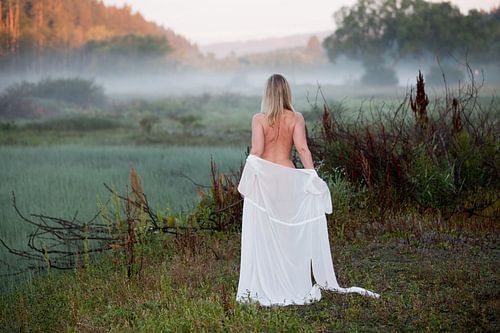 Nude in morning mist - Pretty young woman at sunrise (Erotic nude photography)