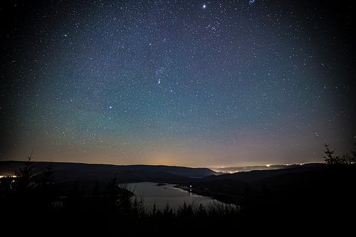 Rursee reservoir under a starry sky by Eus Driessen
