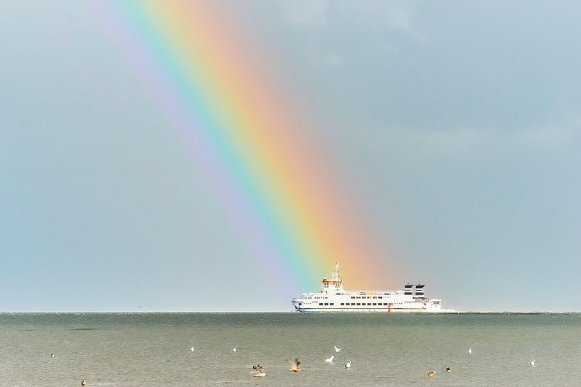 Ferry to Schiermonnikoog with rainbow. by Johan Kalthof