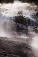 A waterfall in Norway illuminated by the sun