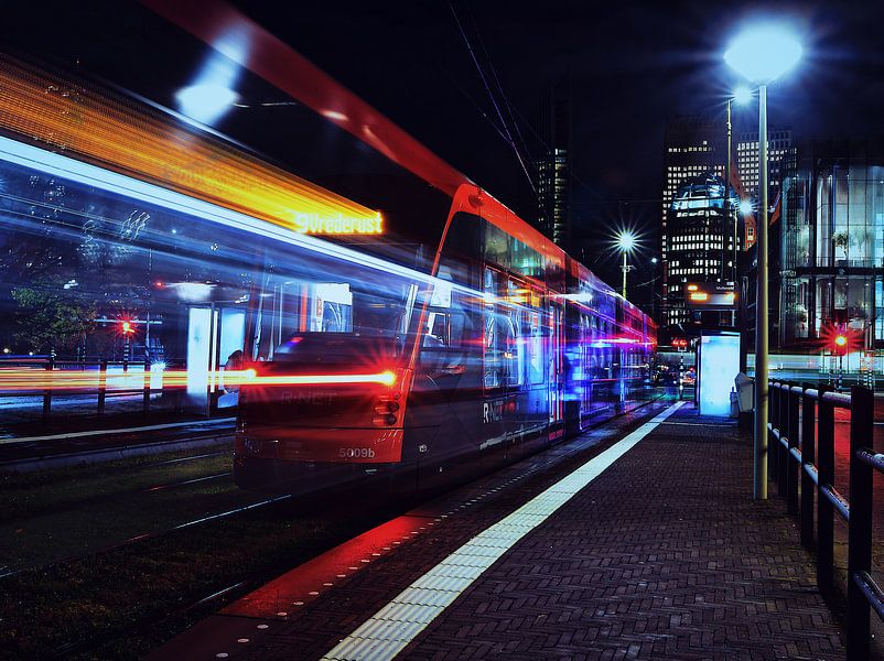 Tram by night for the skyline of The Hague by Michiel van den Bos