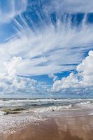 North Sea beach at Castricum, Bakkum aan Zee. reflective cloudy sky