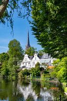 View of old church Kralingen by the pond