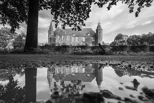 Castle Slot Zuylen reflected in a pool of rainwater (black and white)