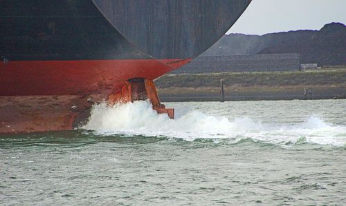 Container ship leaving the harbour of IJmuiden, the Netherlands
