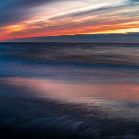 De Noordzee bij zonsondergang van Rob Baken
