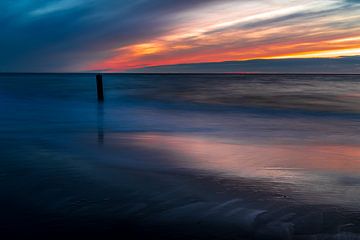 De Noordzee bij zonsondergang van Rob Baken