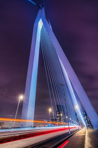 The Erasmus Bridge in Rotterdam Holland with traffic in the evening