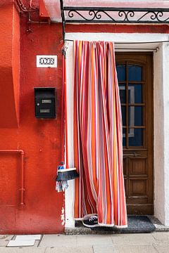 Brightly coloured curtain at home on Burano by Awander
