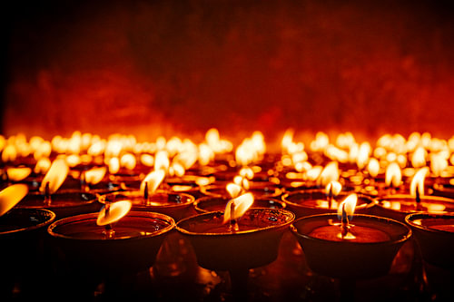Devotional offering lights in a temple.