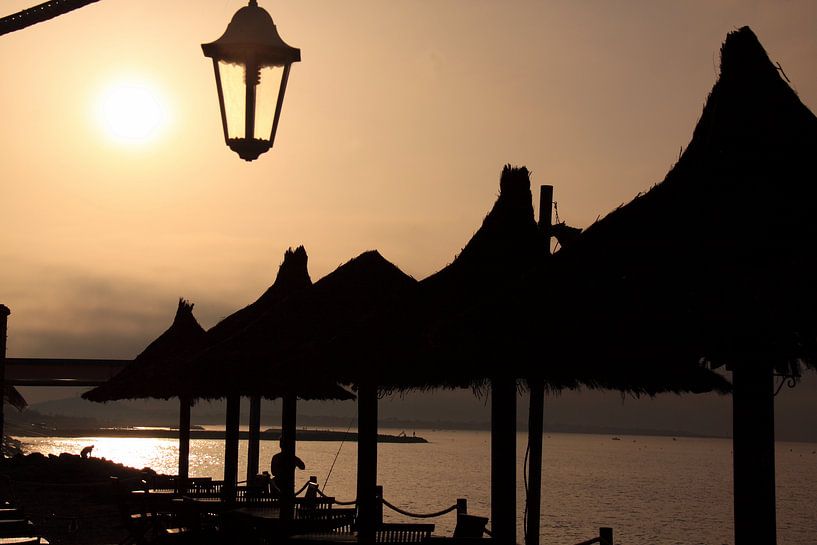 Sunset on the coast of Brittany in France by Bobsphotography