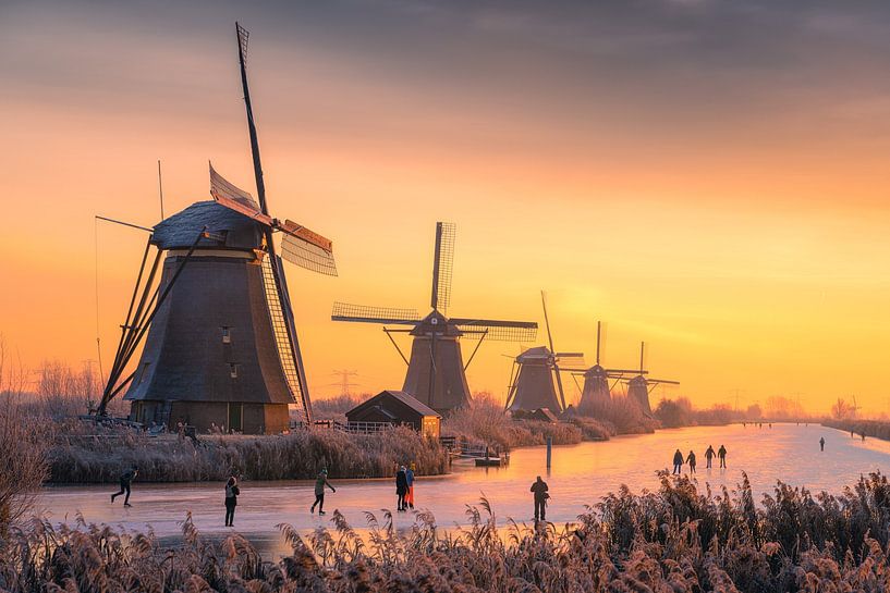 Winter fun and ice skating at Kinderdijk mills by Wilco Bos