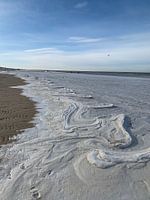Frozen saltwater waves.