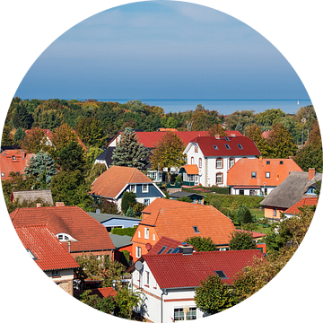 Buildings with blue sky in Wustrow, Germany van Rico Ködder