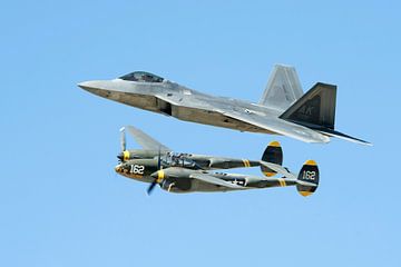 The F-22 and the classic P-38 shares the sky at the Los Angeles County Air Show in Lancaster, Califo