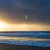 Kitesurfers at sunset by Anouschka Hendriks