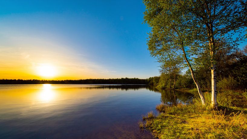 Beautiful sunset on a natural lake by Günter Albers