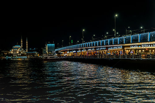 Night-time photograph of the Galata Bridge in Istanbul