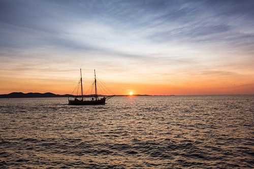 Sailing ship at sunset