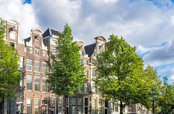 Traditional old building facades at the canals in Amsterdam, the Netherlands