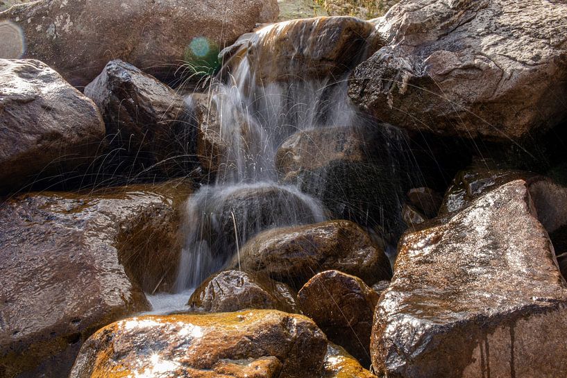 Gushing mountain waterfall by Nicolas Vaillant