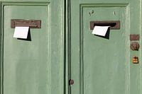 Travel photography. Double green doors with letterboxes