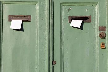 Travel photography. Double green doors with letterboxes