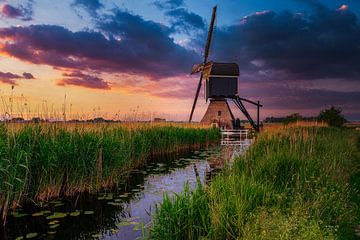 Hollands landschap met zonsondergang van Björn van den Berg
