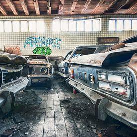 Dilapidated garage with Ford Capri's among others by Erik Noordhoek