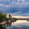 Baltic Sea coast with rocks and trees near Oskarshamn in Sweden by Rico Ködder