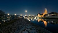 Moon in clear starry sky over Regensburg in Bavaria with landmar