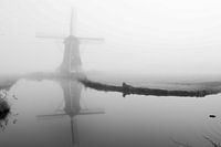 Mill in the mist on the water