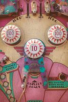 The weathered vintage pinball machine