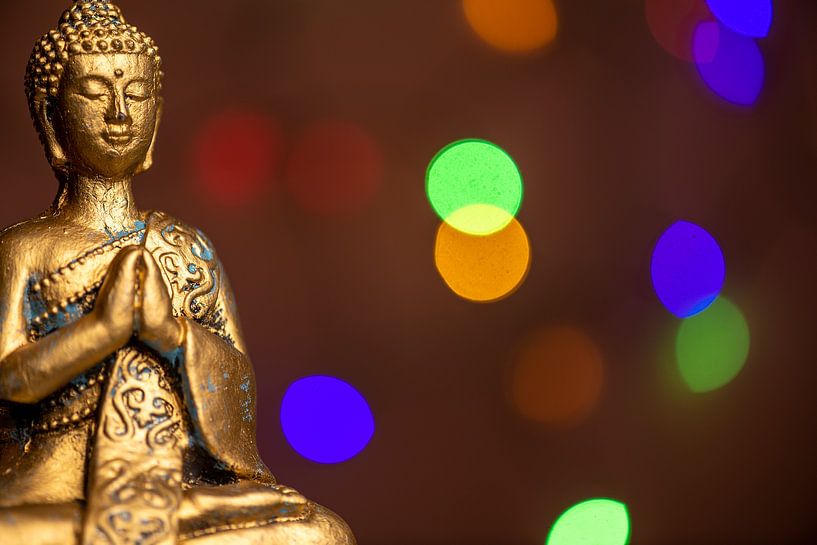 Golden Buddha with colourful play of light by Alexander Baumann