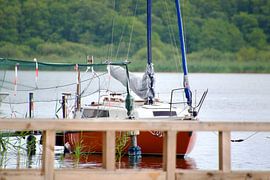 sailboat in lake by StudioFocus