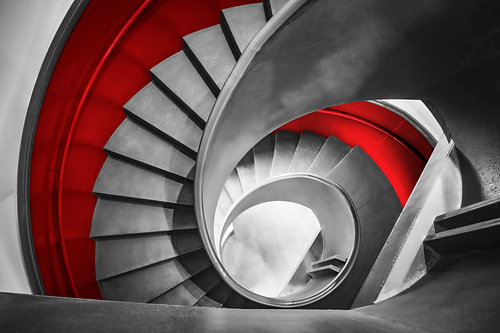 Spiral staircase in grey and red -