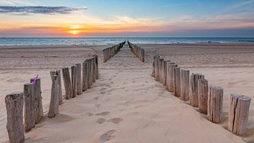 Wave breakers at sunset on the beach near Oostkapelle by Jan Poppe