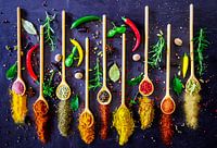 Herbs and spices on wooden spoon