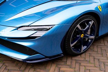 Ferrari SF90 sports car in light blue headlight detail by Sjoerd van der Wal Photography