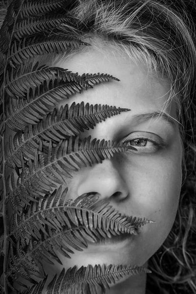 close up of girl behind a fern by Elly de Vries