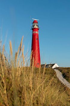 Schiermonnikoog's red lighthouse in autumn sunshine