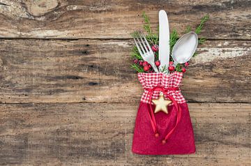 Christmas table setting with decoration on wood background by Alex Winter