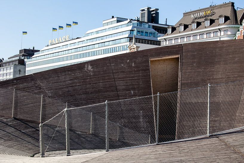 round wooden art front in helsinki where the tourist info sits by Eric van Nieuwland